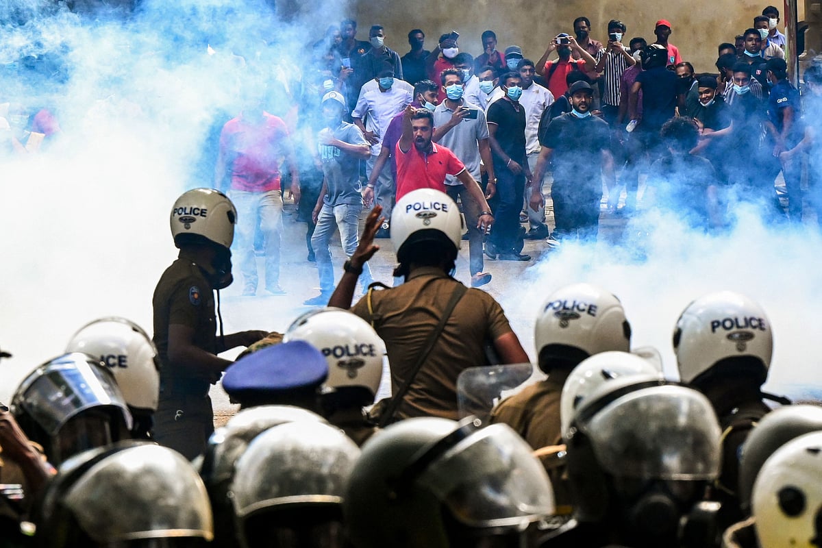 Police use tear gas to disperse Higher National Diploma (HND) students during a demonstration demanding the resignation of Sri Lanka's President Gotabaya Rajapaksa over the country's crippling economic crisis, in Colombo on 21 May, 2022