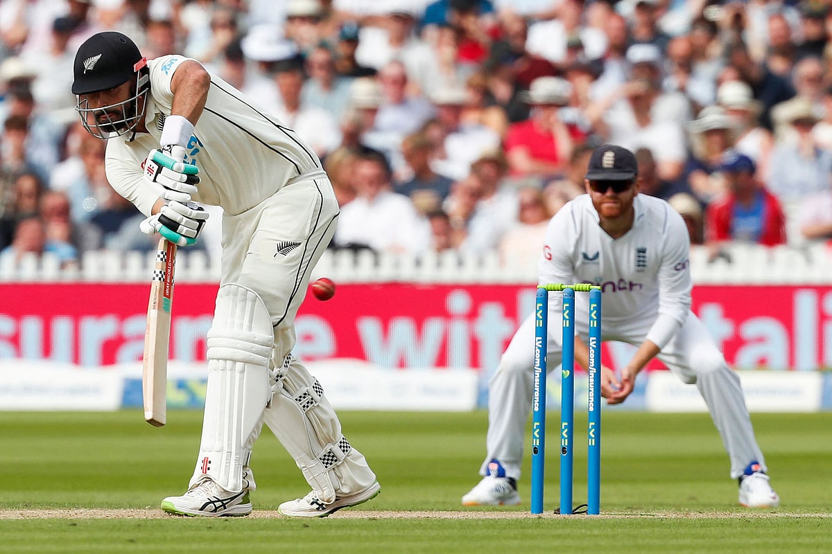 New Zealand's Daryl Mitchell (L) plays a shot to reach a half-century (50 runs) on the second day of the first cricket Test match between England and New Zealand at Lord's cricket ground in London on 3 June, 2022
