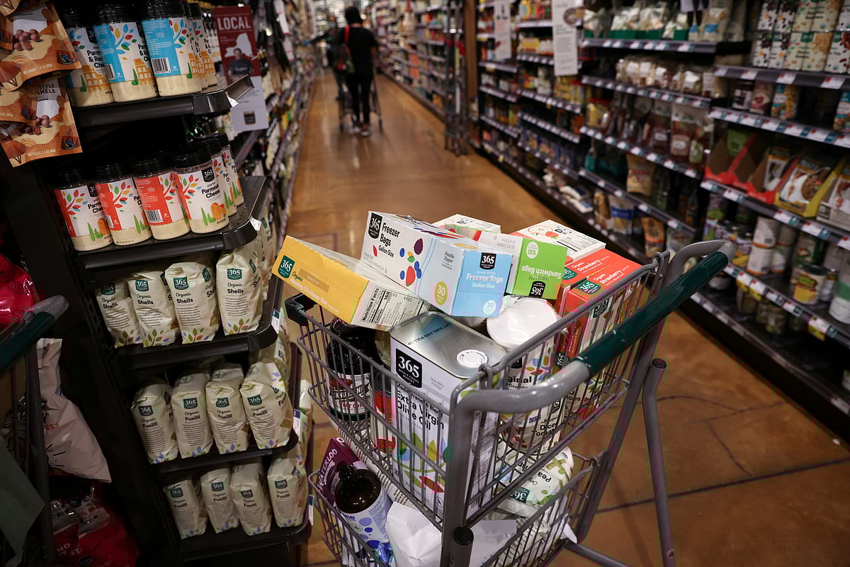 A shopping cart is seen in a supermarket