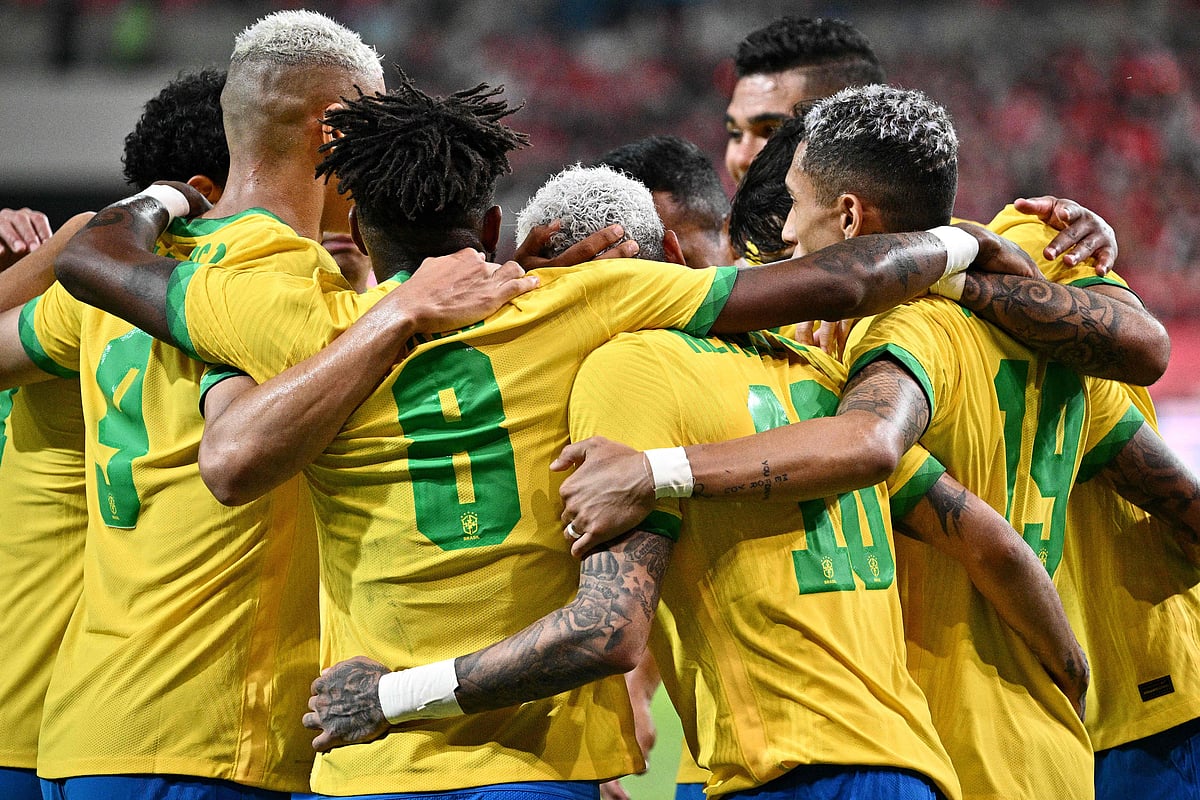 Brazil's forward Neymar (C) celebrates with teammates after he scored a penalty goal during the international football friendly match between South Korea and Brazil at Seoul World Cup Stadium in Seoul on 2 June 2022.
