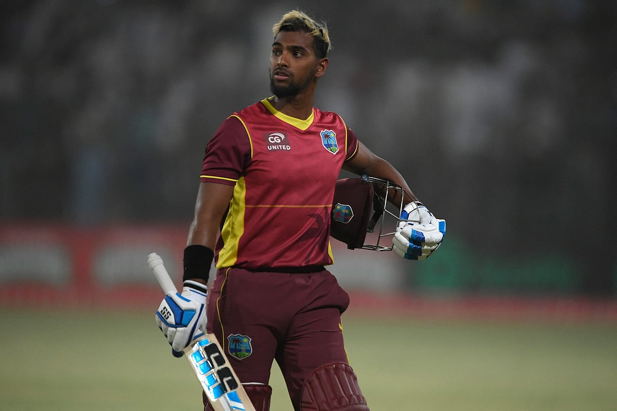 West Indies' captain Nicholas Pooran walks back to pavilion after his dismissal during the third and final one-day international (ODI) cricket match between Pakistan and West Indies at the Multan International Cricket Stadium in Multan on 12 June, 2022