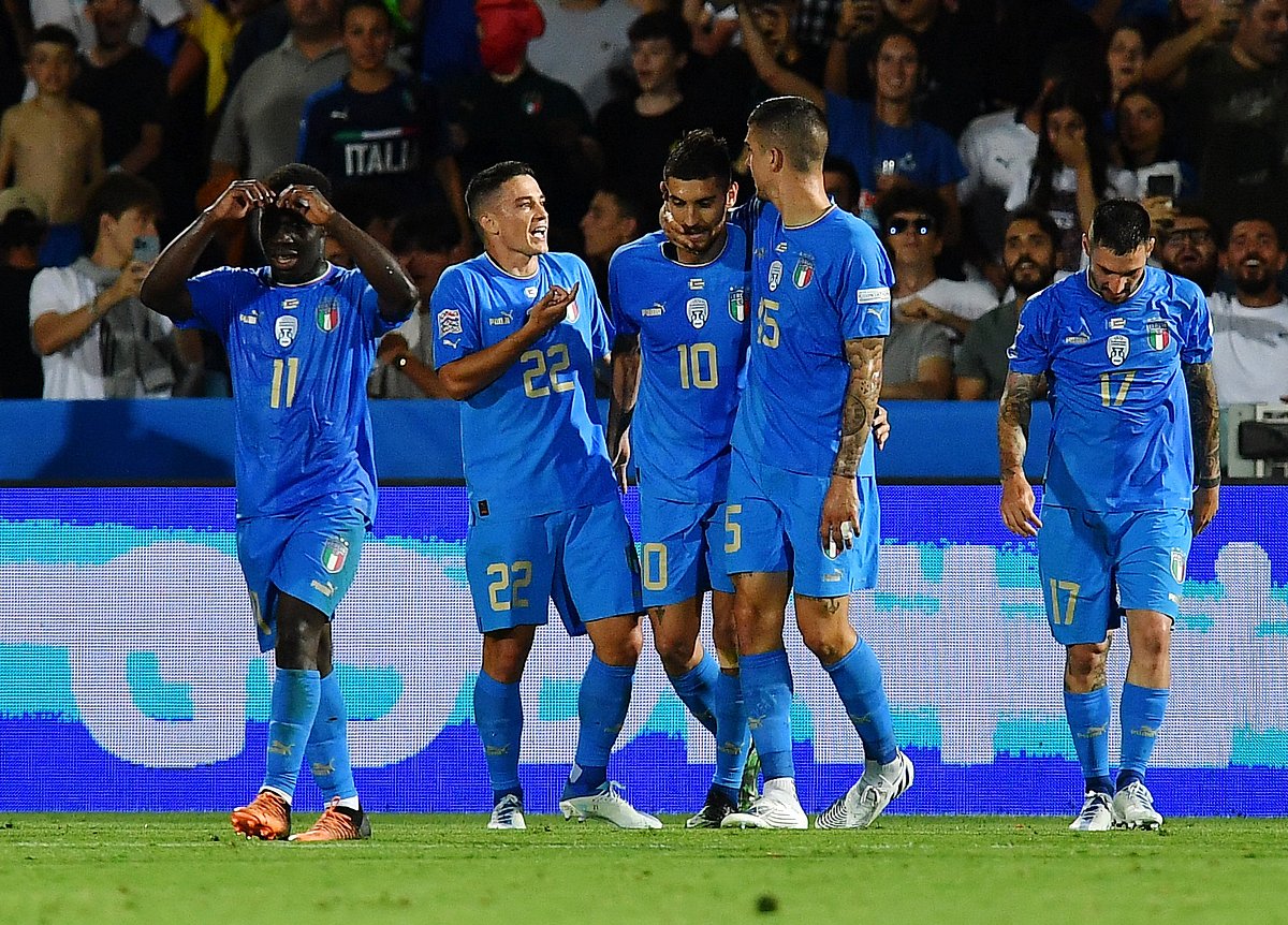 Italy's Lorenzo Pellegrini celebrates scoring their second goal with teammates