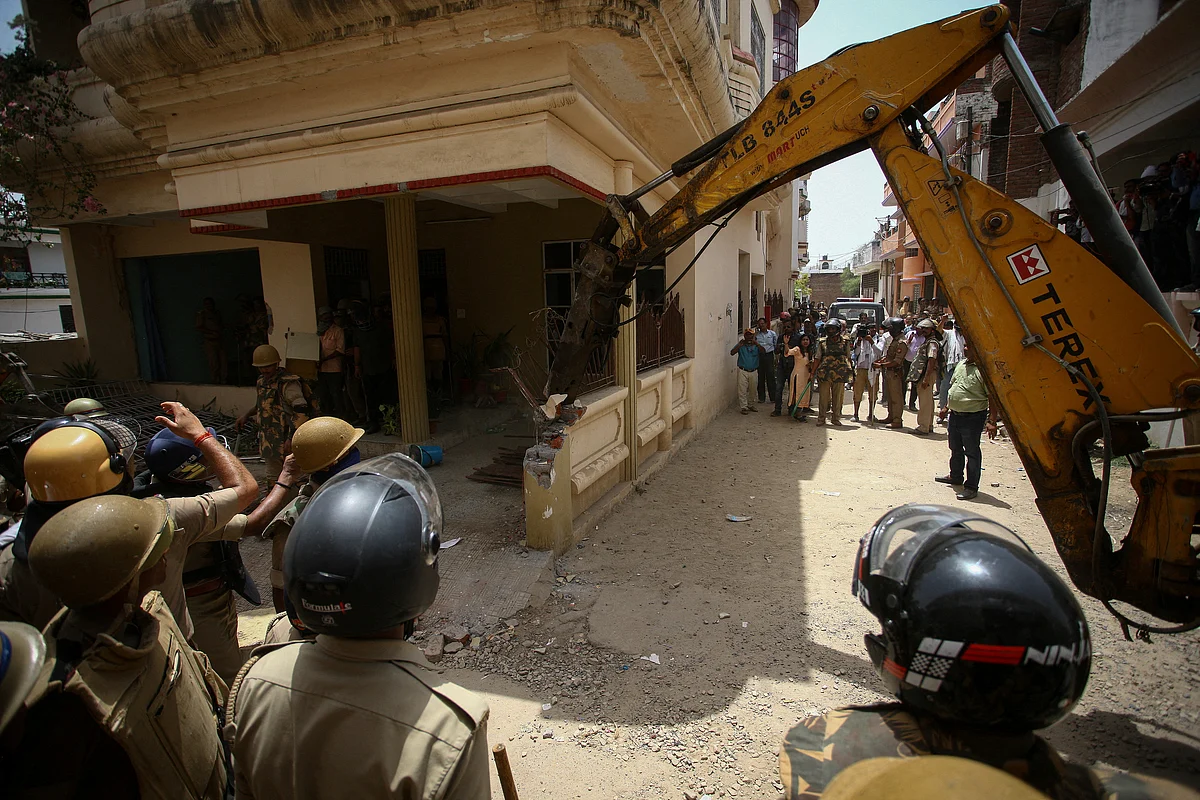 Heavy equipment is used to demolish the house of a Muslim man that Uttar Pradesh state authorities accuse of being involved in riots last week, that erupted following comments about the Prophet Mohammed by India's ruling Bharatiya Janata Party (BJP) members, in Prayagraj, India, on 12 June 2022