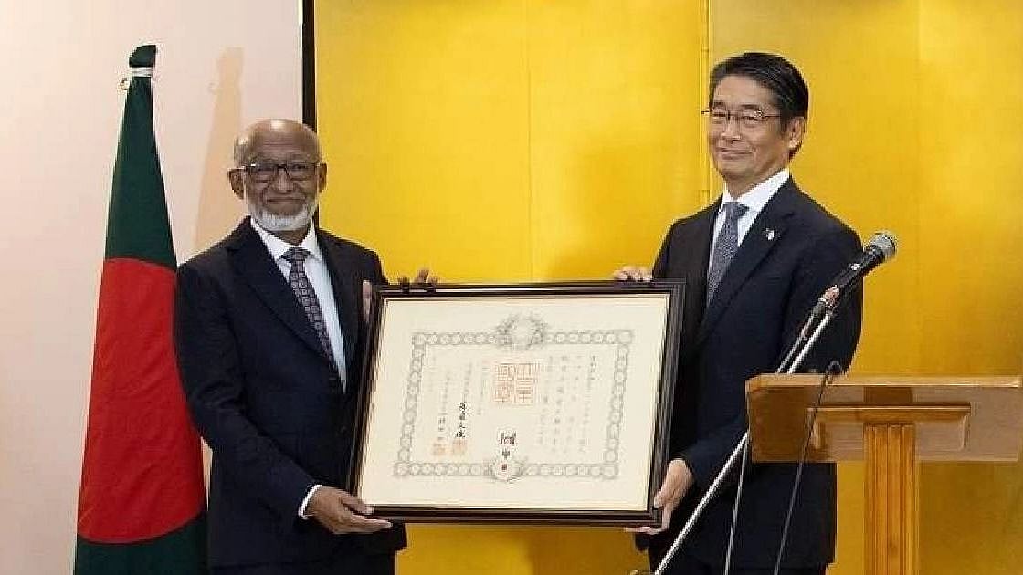 Japan ambassador to Bangladesh Ito Naoki hands over the award to businessman Abdul Haque