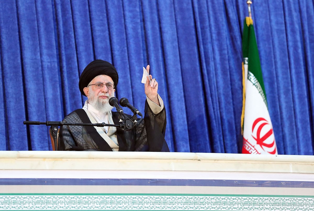 A handout picture provided by the office of Iran's Supreme Leader Ayatollah Ali Khamenei on 4 June 2022 shows him greeting the crowd during a ceremony marking the death anniversary of his predecessor Ayatollah Ruhollah Khomeini, south of the Iranian capital Tehran.