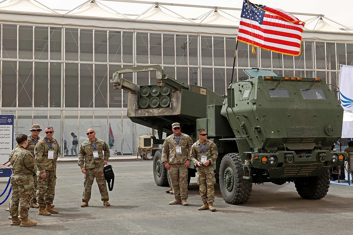 In this file photo taken on March 06, 2022 US military personnel stand by a M142 High Mobility Artillery Rocket System (HIMARS) during Saudi Arabia’s first World Defense Show, north of the capital Riyadh. The United States is sending Himars advanced multiple rocket systems to Ukraine, a US official said 31 May, 2022, ending days of speculation over the latest upgrade of military aid to Kyiv in its fight against Russia