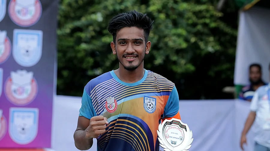 Nayeem Islam poses with the highest goal scorers trophy