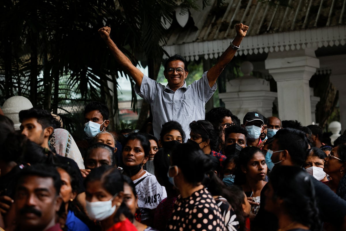 People wait to visit the President's house on the day after demonstrators entered the building, after President Gotabaya Rajapaksa fled, amid the country's economic crisis, in Colombo, Sri Lanka on 10 July, 2022