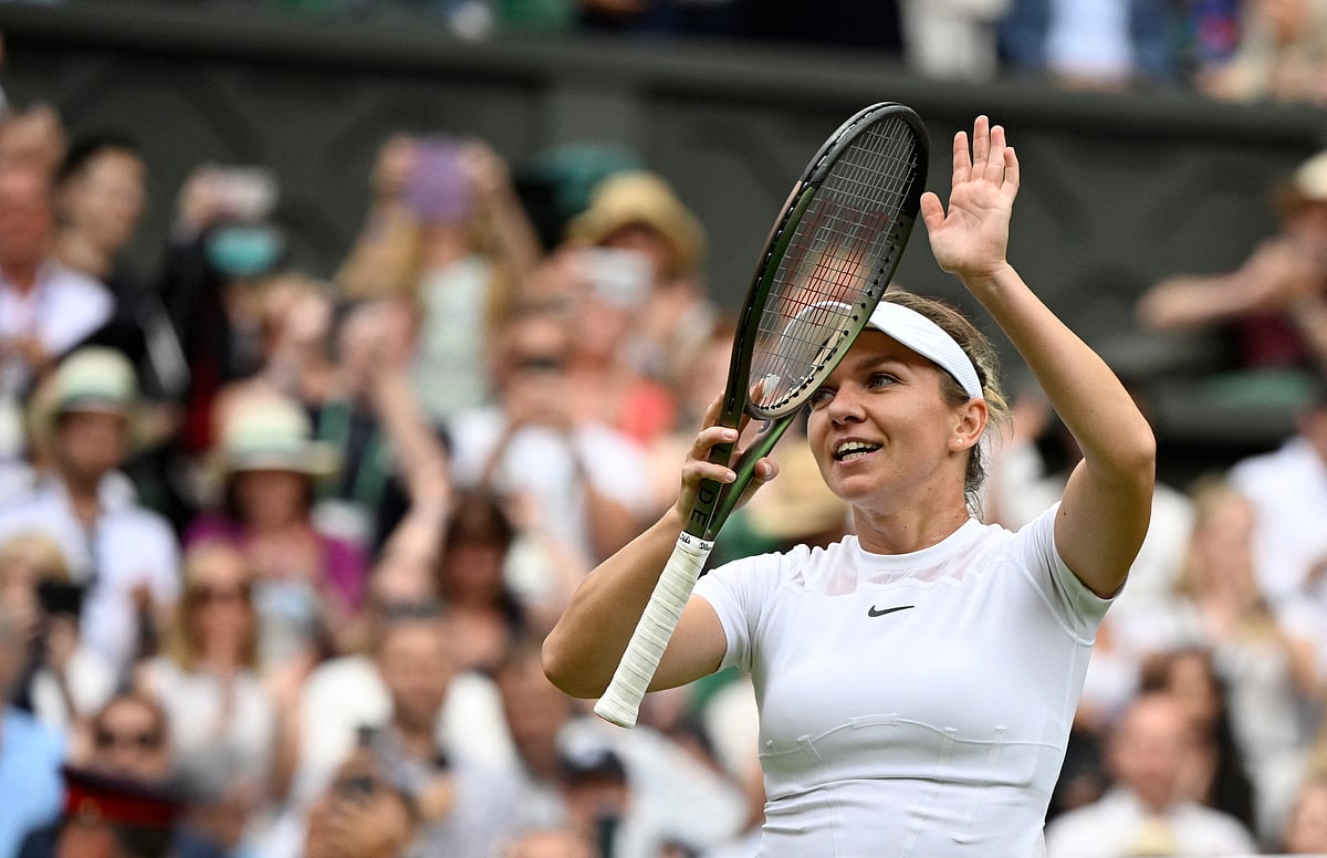 Romania's Simona Halep celebrates winning her quarter final match against Amanda Anisimova of the US