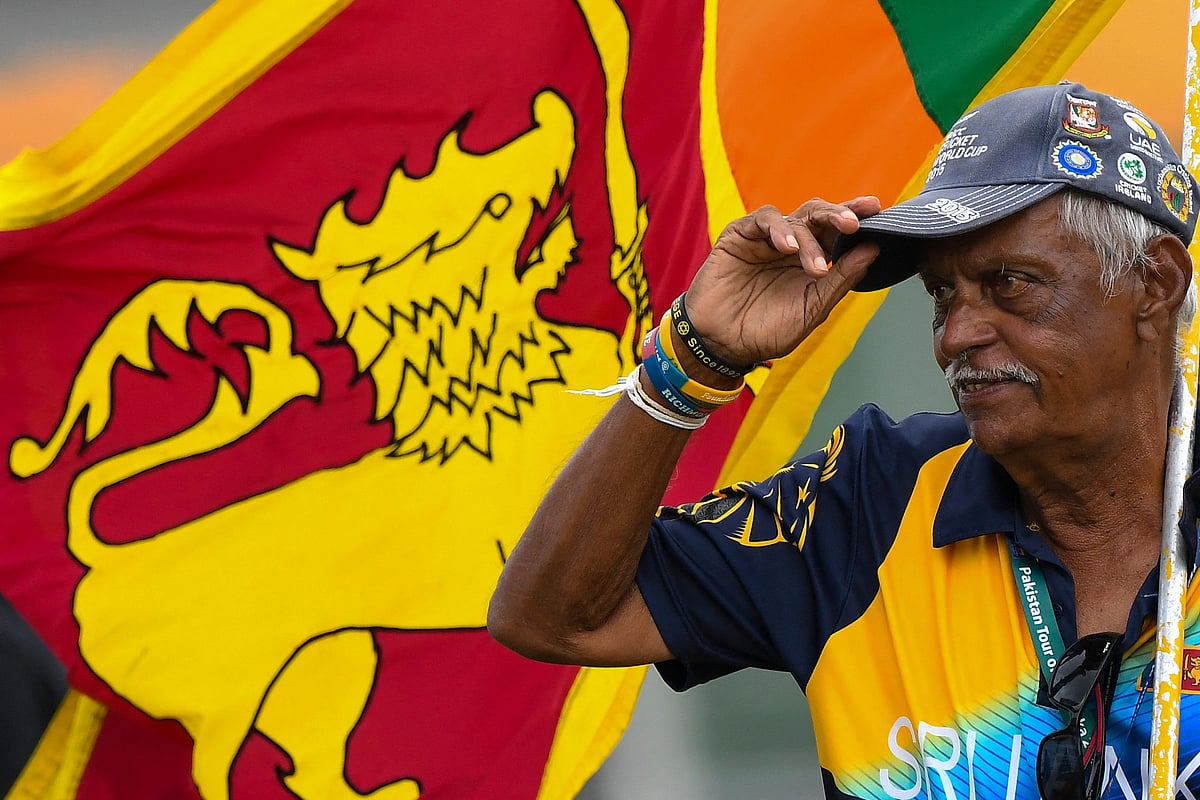 In this photograph taken on 19 July, 2022, Sri Lanka's cricket fan Percy Abeysekera watches the fourth day play of the first cricket Test match between Sri Lanka and Pakistan at the Galle International Cricket Stadium in Galle
