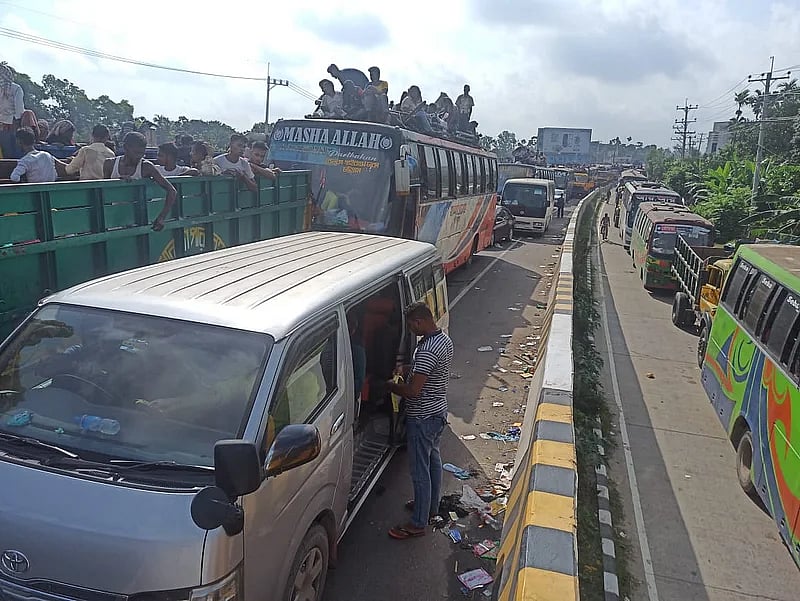 Because of traffic congestion, various vehicles stood still on the highway. Photo taken from Tangail's Karatia area on Saturdaying.