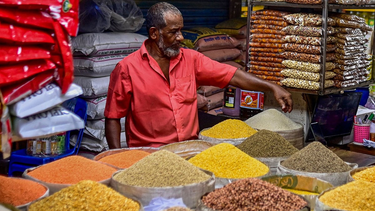 A shopkeeper waits for customers at a wholesale market on 13 June 2022