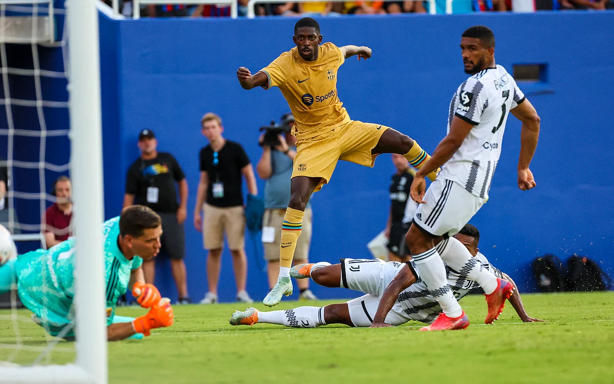 FC Barcelona forward Ousmane Dembele (7) scores a goal past Juventus goalkeeper Wojciech Szczesny during the first half at the Cotton Bowl in Dallas, Texas, US on 26 July, 2022