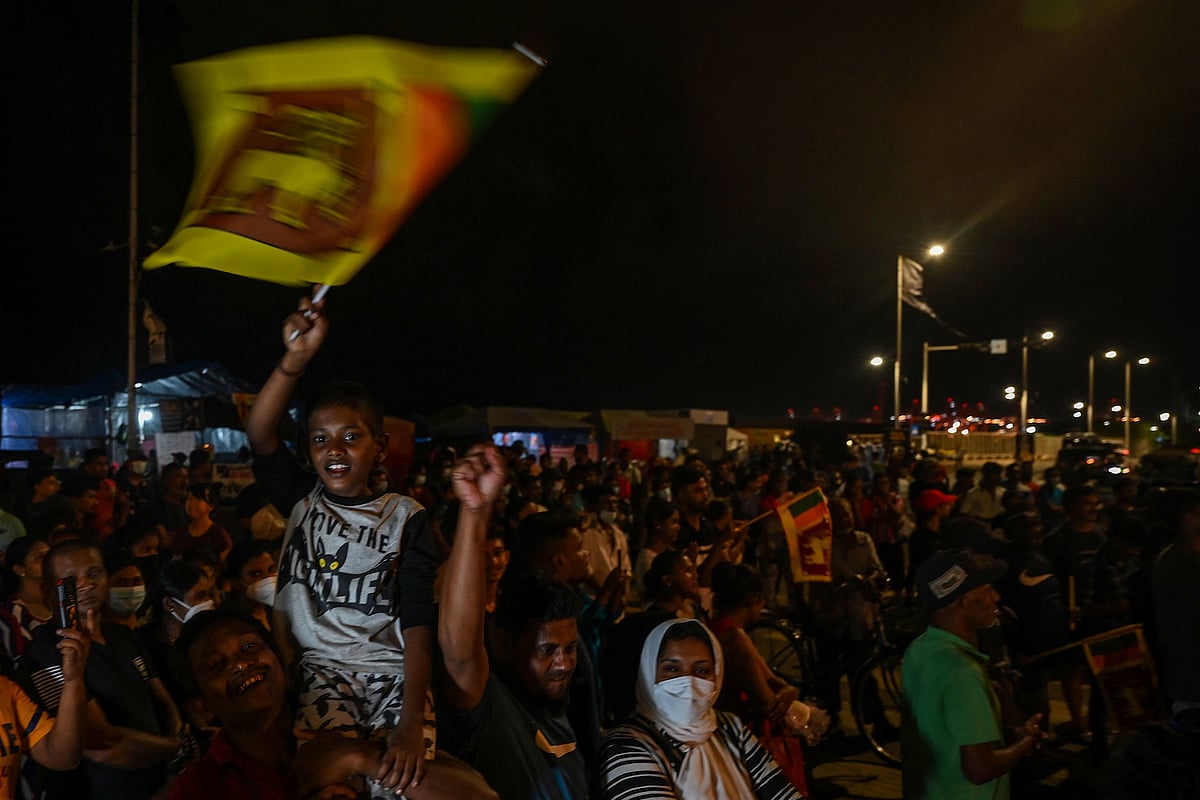 Demonstrators take part in a celebration as Sri Lanka's protest movement reached its 100th day at the Galle face protest area near Presidential secretariat in Colombo on July 17, 2022