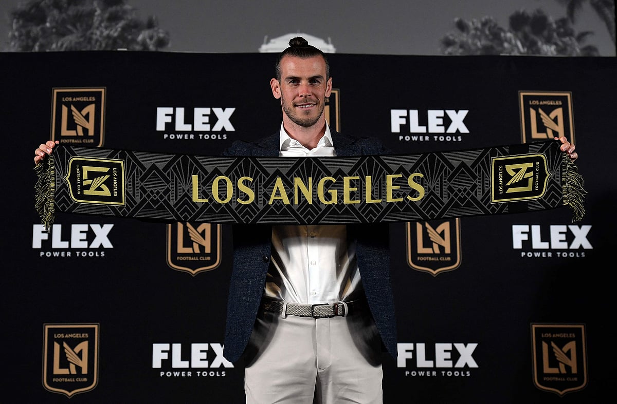 In this file photo taken on July 11, 2022, forward Gareth Bale holds the Los Angeles Football Club scarf during a news conference after he was introduced at Banc of California Stadium in Los Angeles, California. Wales captain Gareth Bale got his first taste of Major League Soccer action on 17 July, 2022