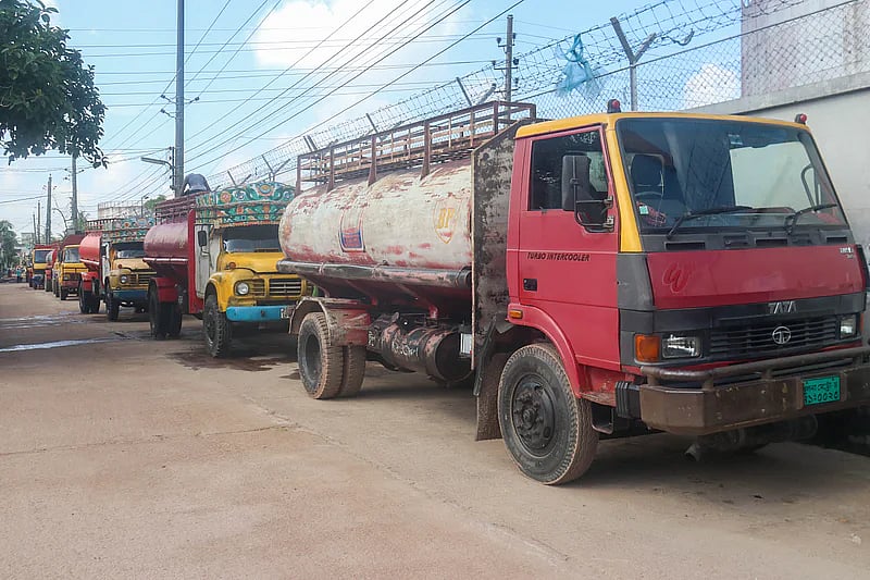 Tank lorries remain idle on the street during the strike of fuel traders and tank lorry-owners in Khulna.