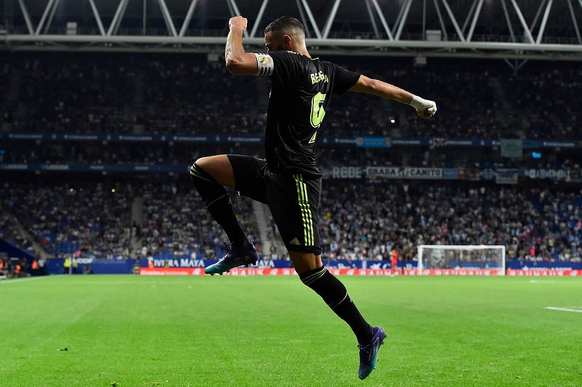 Real Madrid's French forward Karim Benzema celebrates scoring his team's second goal during the Spanish League football match between RCD Espanyol and Real Madrid CF at the RCDE Stadium in Cornella de Llobregat on 28 August, 2022