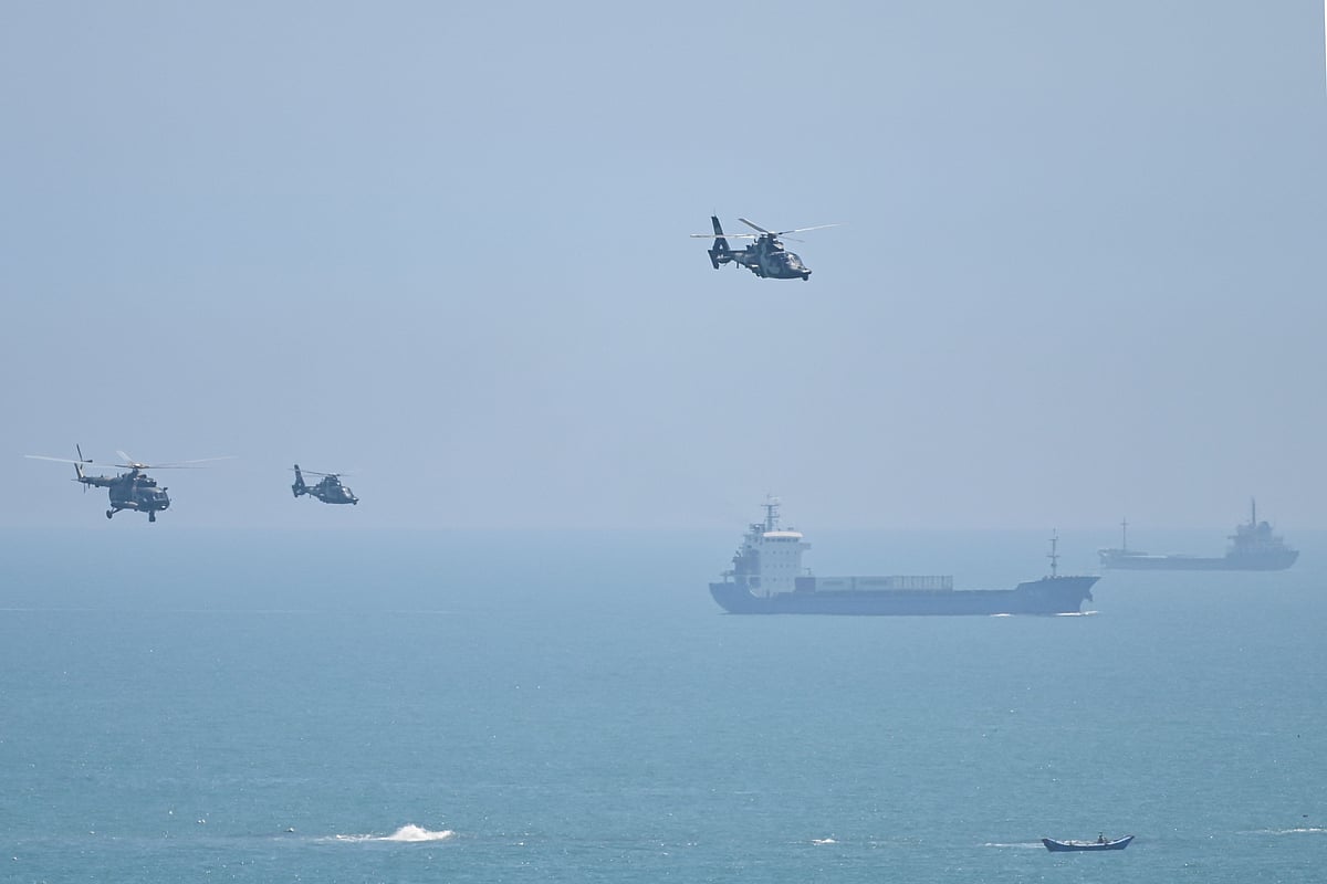 Chinese military helicopters fly past Pingtan island, one of mainland China's closest point from Taiwan, in Fujian province on 4 August, 2022
