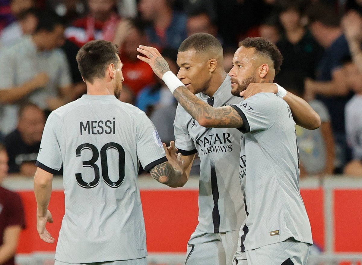 Paris St Germain's Kylian Mbappe celebrates scoring their seventh goal with teammates Lionel Messi and Neymar Junior during a Ligue 1 match against Lille at Stade Pierre-Mauroy, Villeneuve-d'Ascq, France on 21 August 2022