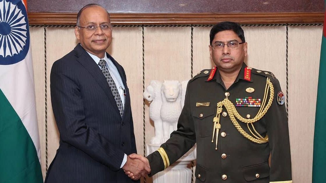 Principal staff officer of Armed Forces Division of Bangladesh Lt Gen Waker-Uz-Zaman and Indian defence secretary Ajay Kumar shakes hand at the meeting