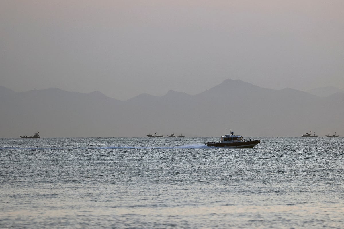 A Taiwan Coast Guard ship travels past the coast of China, in the waters off Nangan island of Matsu archipelago in Taiwan 16 August, 2022