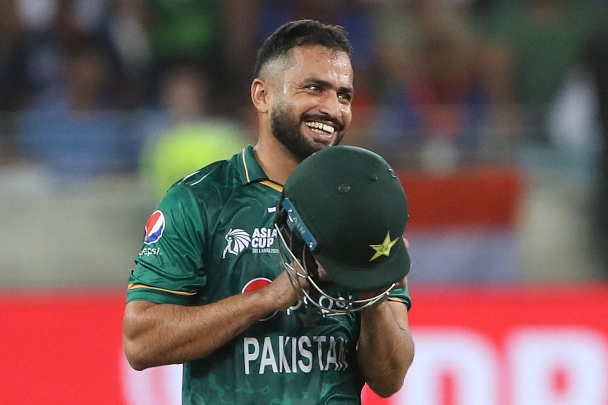 Pakistan's Mohammad Nawaz smiles as he wears his helmet during the Asia Cup Twenty20 international cricket Super Four match between India and Pakistan at the Dubai International Cricket Stadium in Dubai on 4 September, 2022
