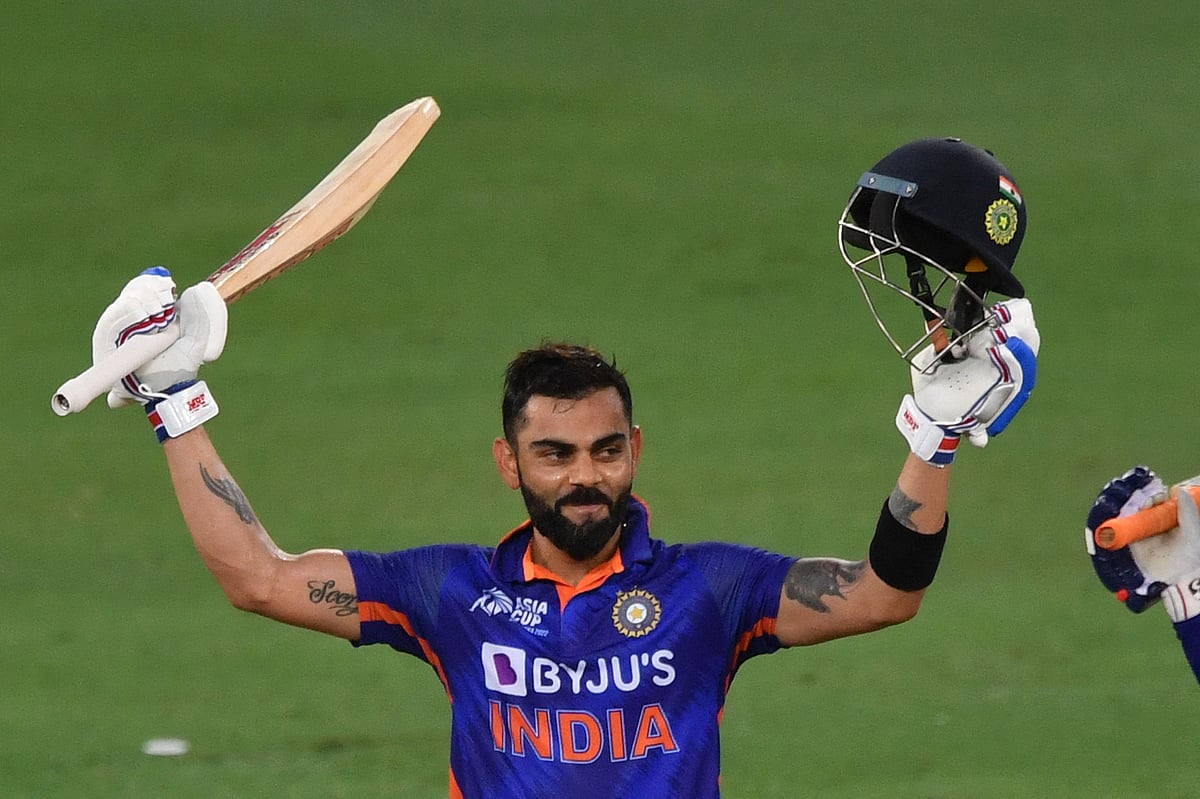 India's Virat Kohli celebrates after scoring a century (100 runs) during the Asia Cup Twenty20 international cricket Super Four match between Afghanistan and India at the Dubai International Cricket Stadium in Dubai on 8 September, 2022