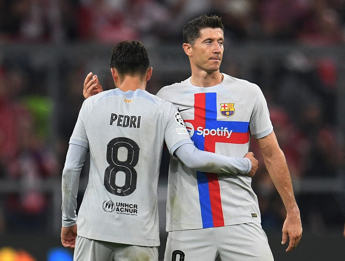 FC Barcelona's Robert Lewandowski looks dejected with Pedri after their Champions League Group C match against Bayern Munich at the Allianz Arena in Munich, Germany on 13 September, 2022