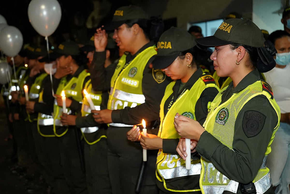 Colombian police officers take part in a tribute at the Metropolitan Police in Neiva on 2 September 2022, after an attack using explosives killed eight police officers.