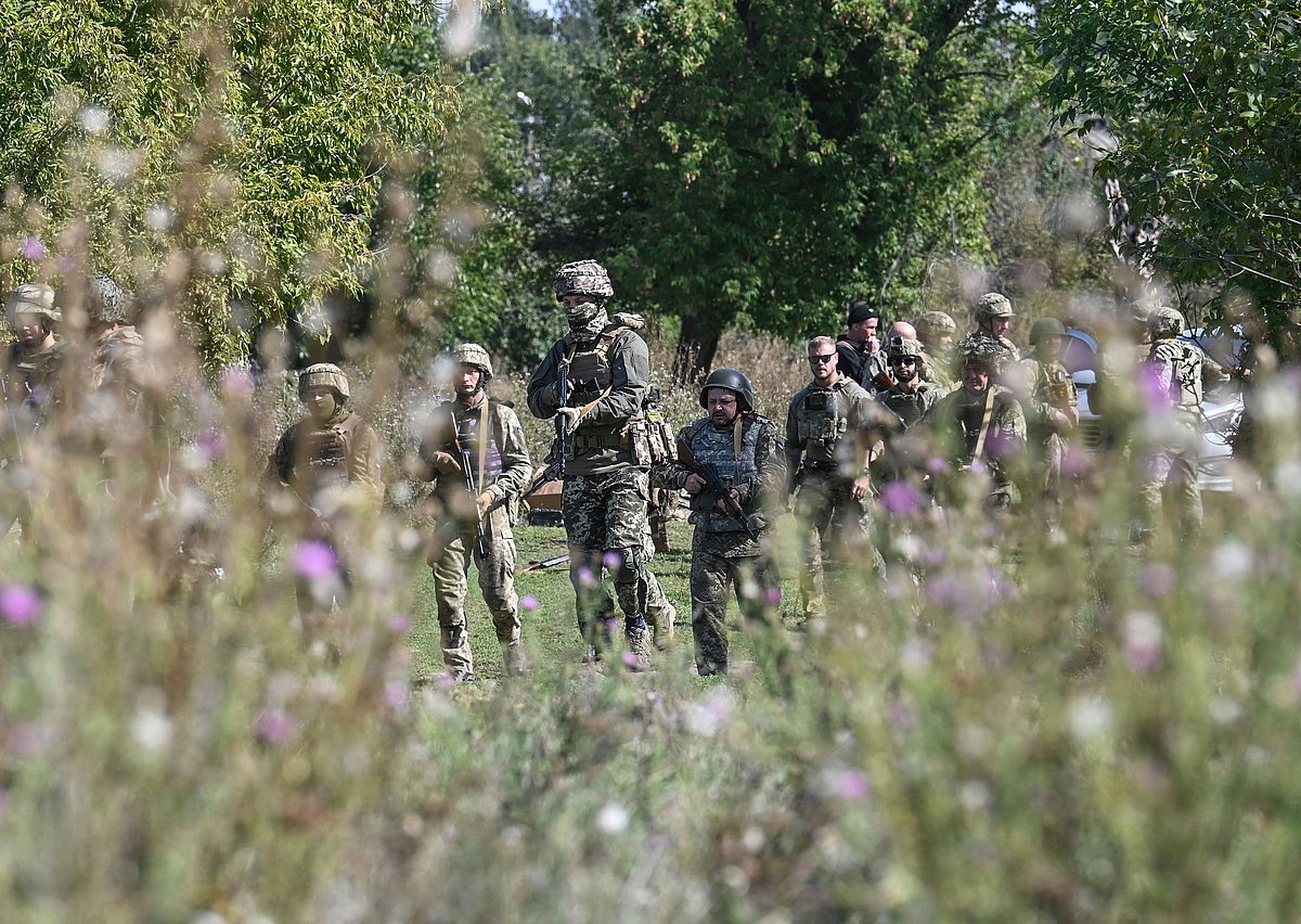 Volunteers take part in training during courses with The Mozart Group, in the Donetsk region on 22 September, 2022, amid the Russian invasion of Ukraine