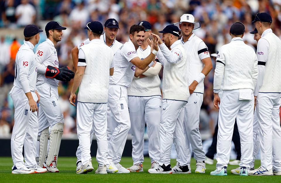 England's James Anderson celebrates with teammates after taking the wicket of South Africa's Sarel Erwee Action.
