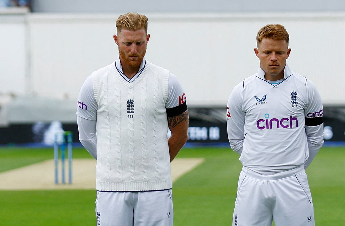 England's Ben Stokes and Ollie Pope stand during a minutes silence before the match while wearing black armbands following the passing of Britain's Queen Elizabeth II before beginning the third Test between England and South Africa at the Oval, London, Britain on 10 September, 2022