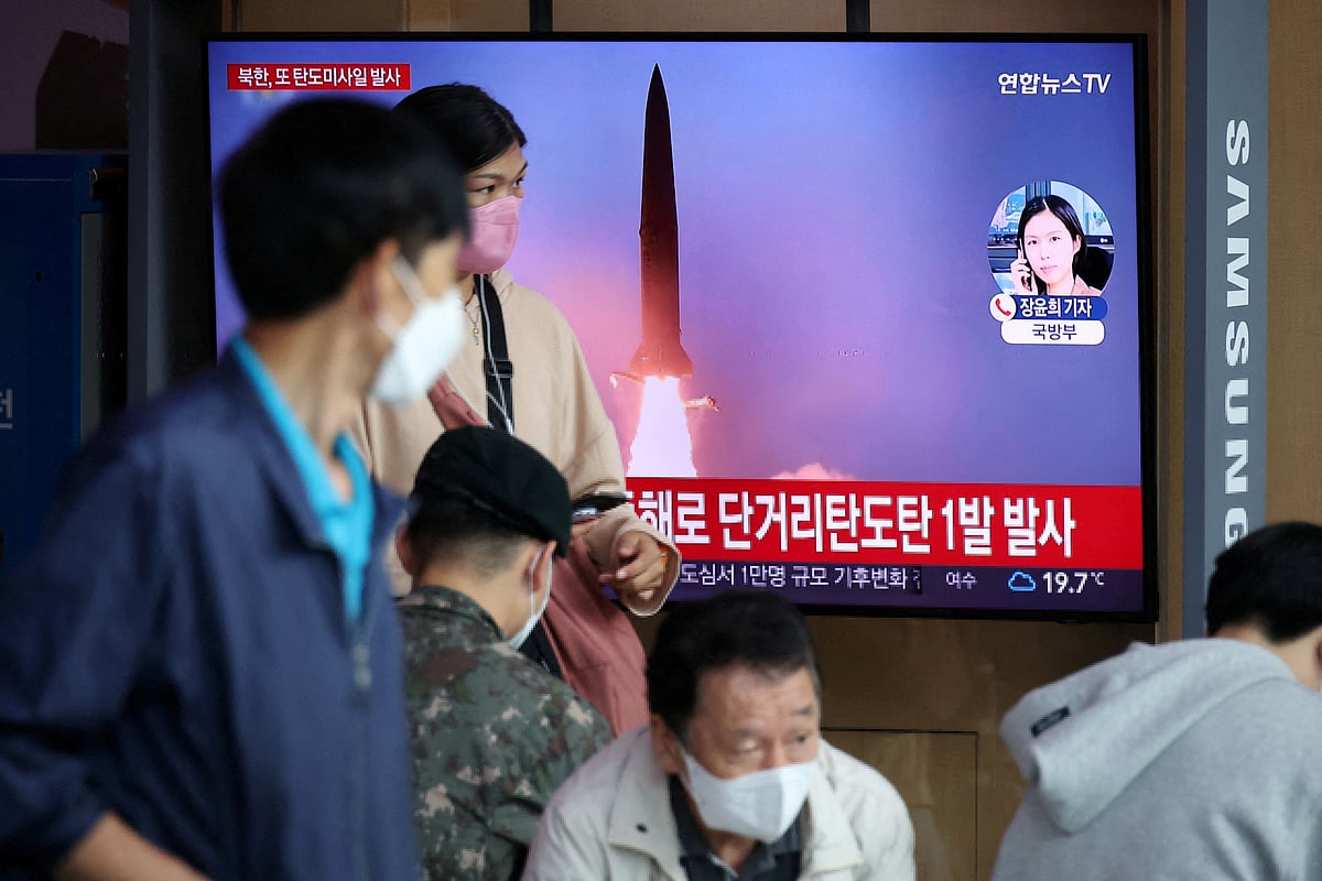 People watch a TV broadcasting a news report on North Korea firing a ballistic missile towards the sea off its east coast, in Seoul, South Korea on 25 September, 2022