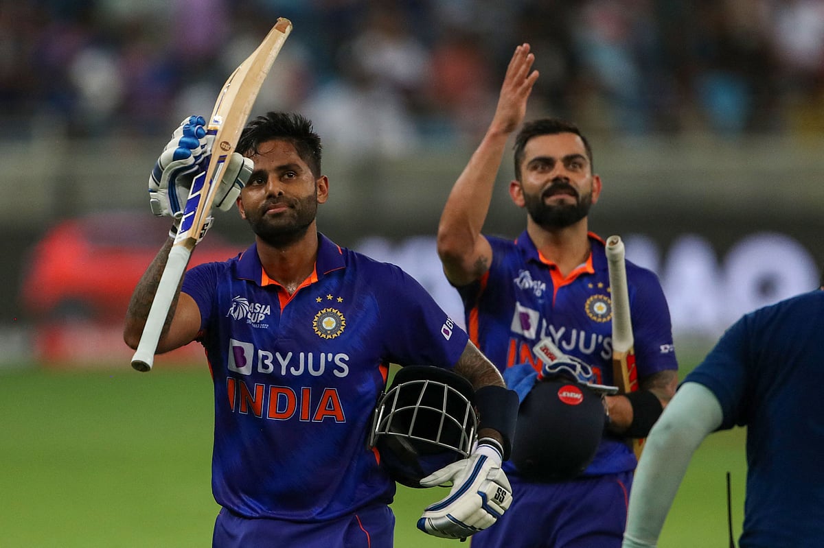 India's Virat Kohli (R) and his teammate Suryakumar Yadav leaves the field after their innings during the Asia Cup Twenty20 international cricket match between India and Hong Kong at the Dubai International Cricket Stadium in Dubai on 31 August 2022.