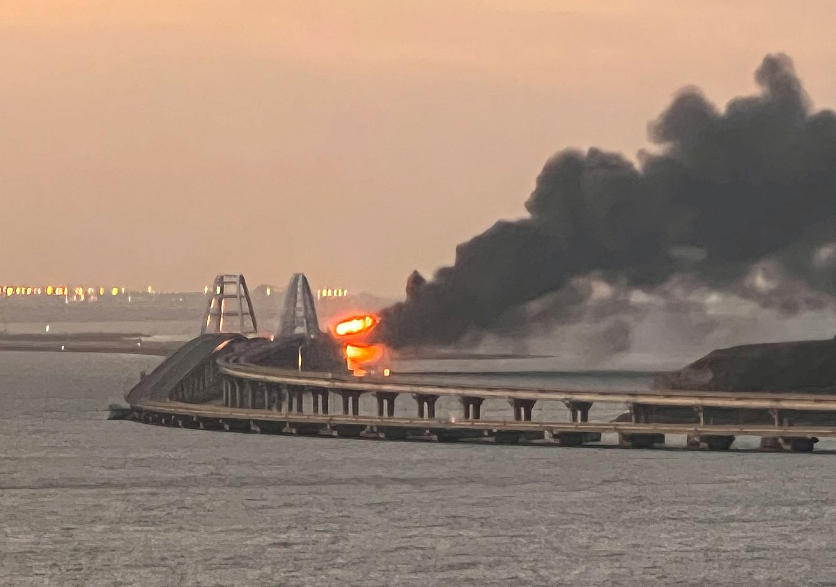 A view shows a fire on the Kerch bridge at sunrise in the Kerch Strait, Crimea, 8 October, 2022.