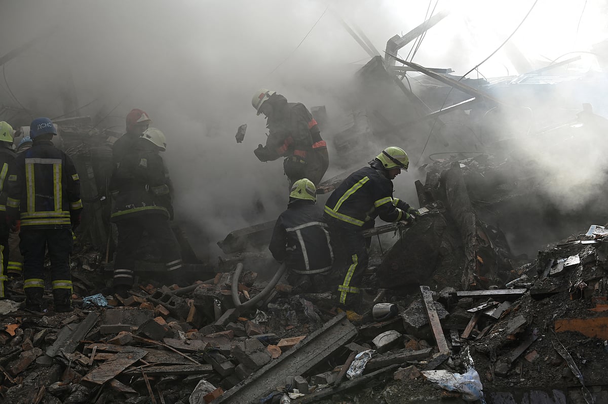 Rescuers work at the site of a residential building heavily damaged by a Russian missile strike, amid their attack on Ukraine, in Zaporizhzhia, Ukraine October 6, 2022.