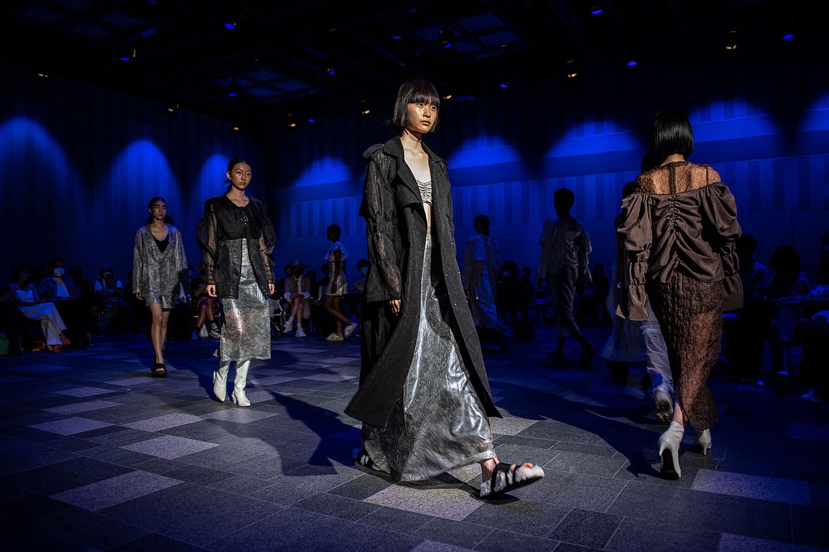 In this file photo taken on 31 August, 2022, models display creations from the AYÂME 2023 S/S Collection by Japanese designer Aya Takeshima at Tokyo Fashion Week in Tokyo. While the loss of fashion greats Kenzo Takada and Issey Miyake heralded the end of a fashion era, decades after Japanese design revolutionised Parisian catwalks in the 1970s and '80s, a new generation of designers are striving to emulate their global success.