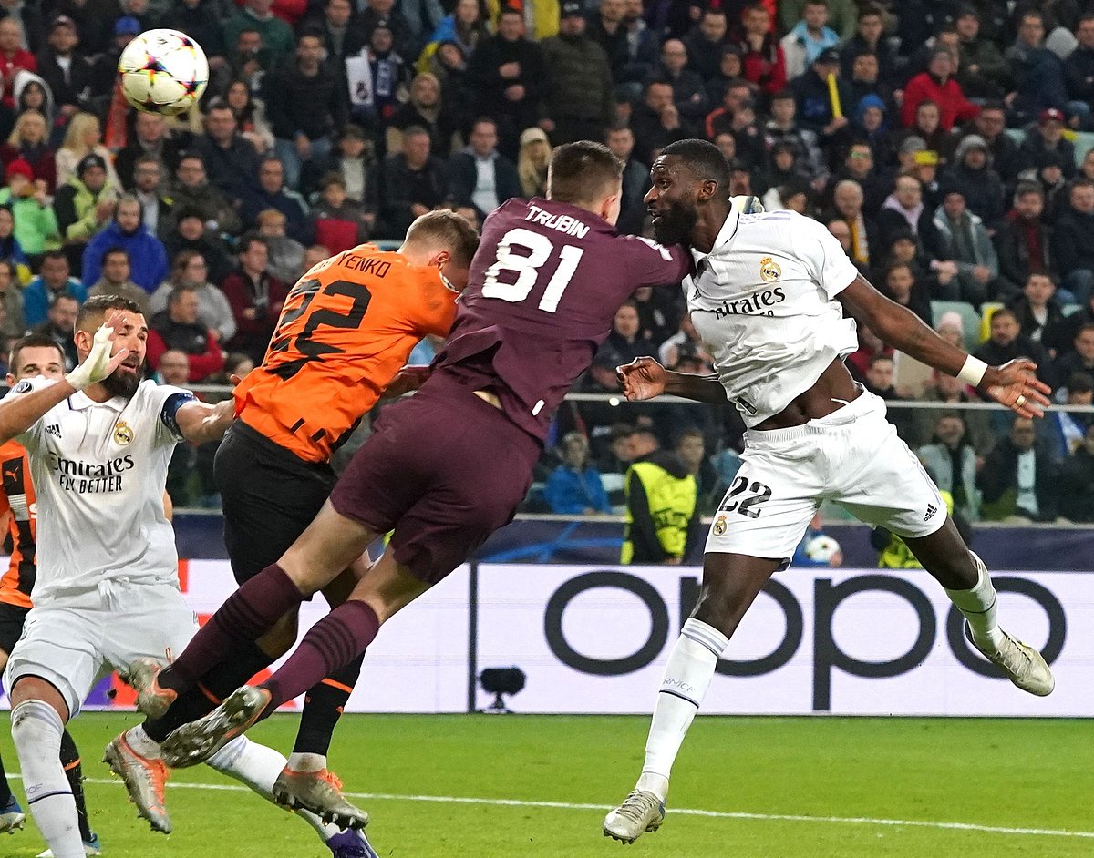 Real Madrid's German defender Antonio Rudiger (R) scores the 1-1 goal Shakhtar Donetsk's Ukrainian goalkeeper Anatoliy Trubin (2nd R) and Shakhtar Donetsk's Ukrainian defender Mykola Matviyenko (3rd R) try to stop the ball during the UEFA Champions League group F football match Shakhtar Donetsk vs Real Madrid in Warsaw, Poland, on 11 October, 2022