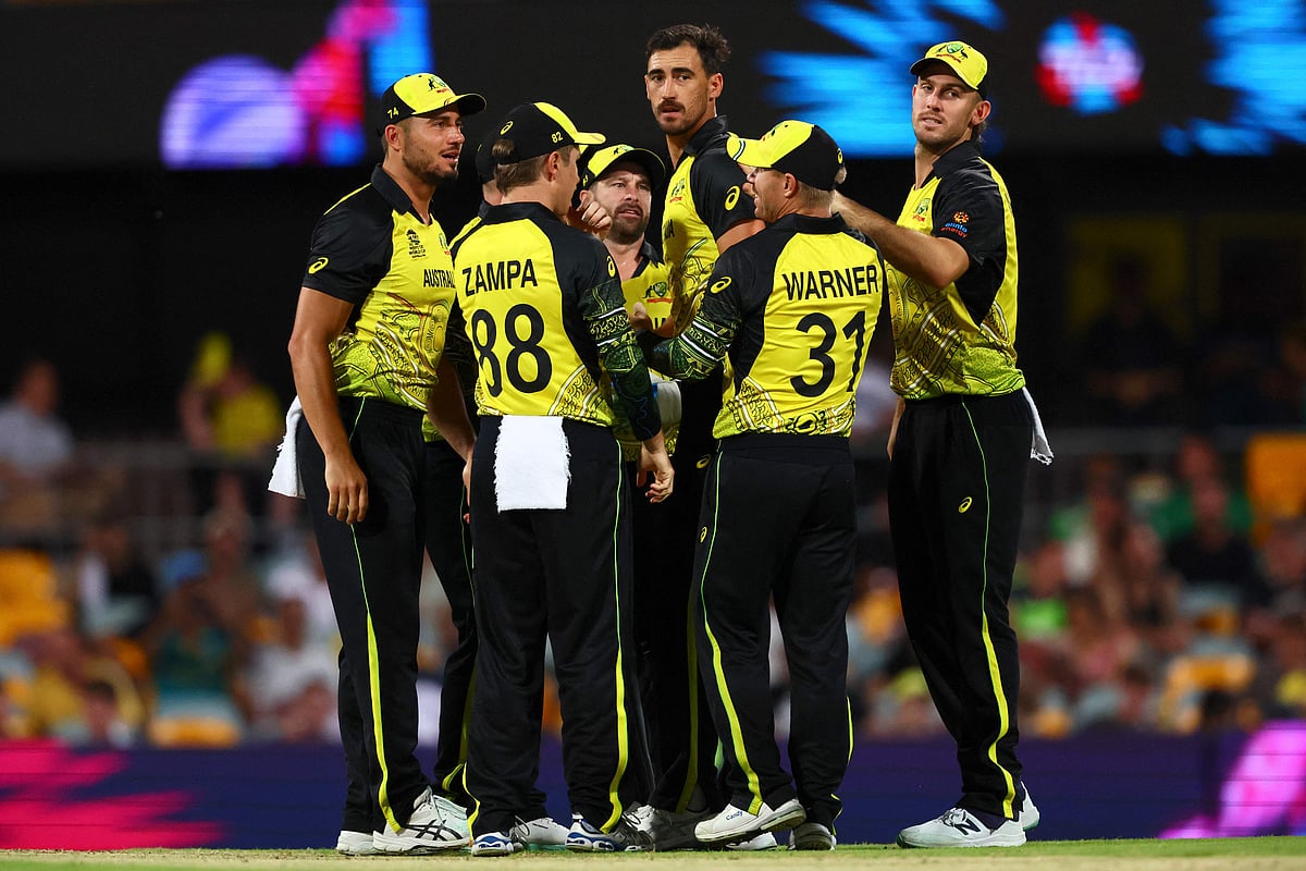 Australia's Mitchell Starc (C) celebrates his wicket of Ireland's Curtis Campher with teammates during the ICC men's Twenty20 World Cup 2022 match between Australia and Ireland at The Gabba on 31 October, 2022 in Brisbane