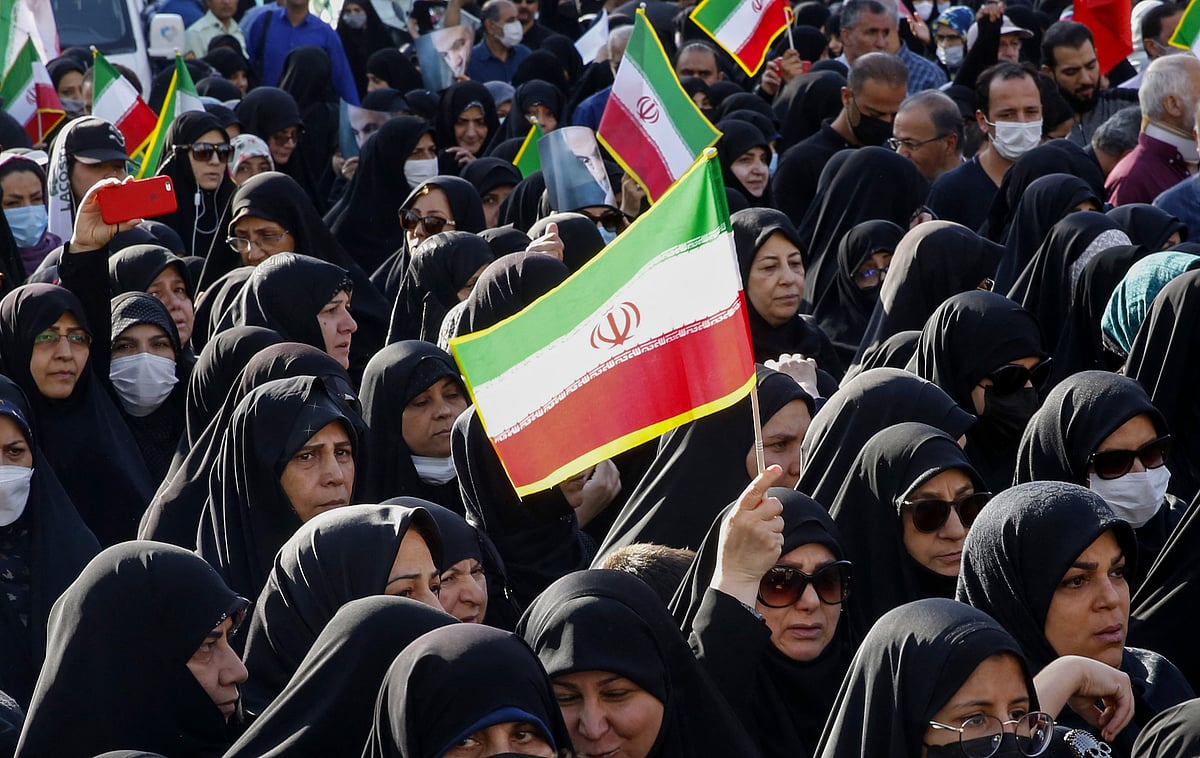 Iranians take part in a pro-government rally in Tajrish square north of Tehran, on 5 October, 2022, condemning recent anti-government protests over the death of Mahsa Amini