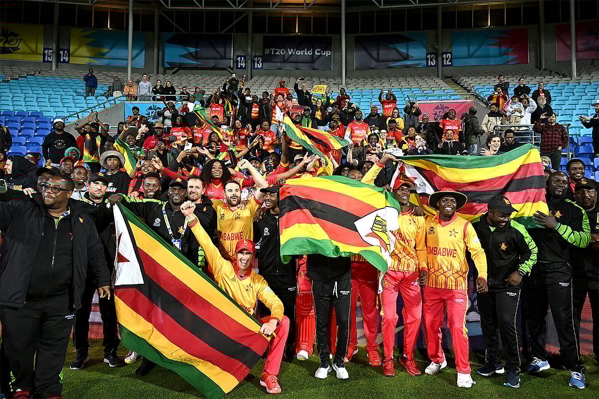 Zimbabwean cricketers celebrate with fans after qualifying for the Super 12