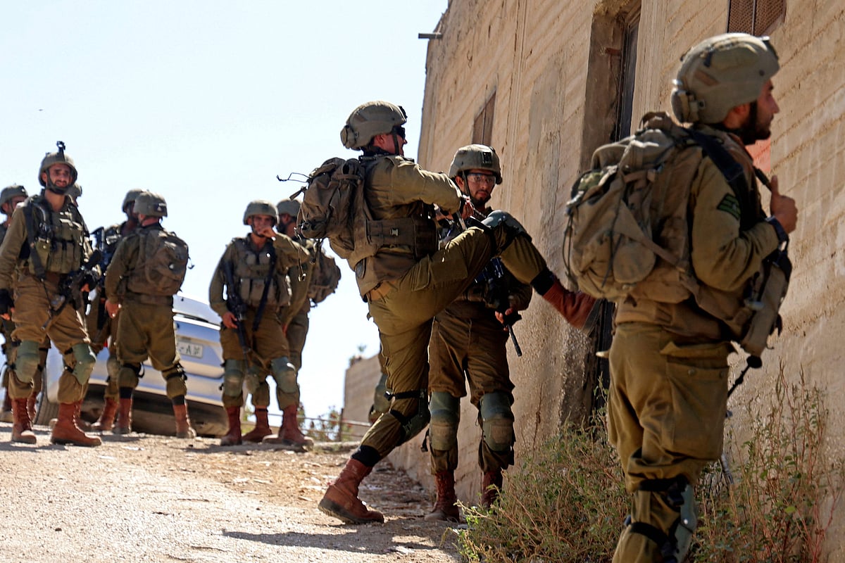 Israeli security forces search for suspects in the village of Salem, east of Nablus, on 2 October, 2022