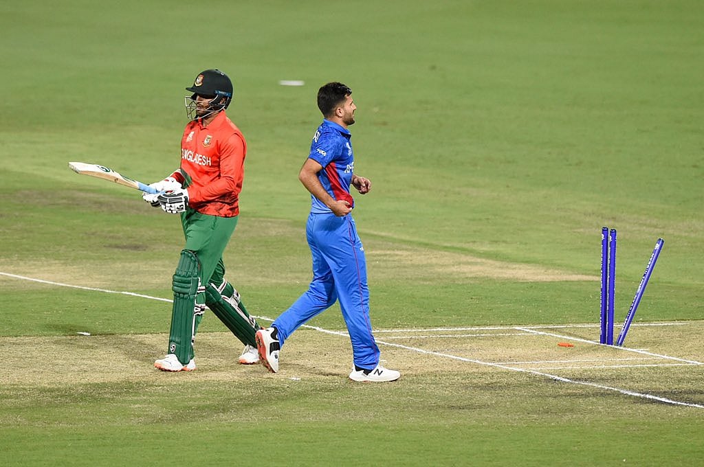 Shakib Al Hasan walks off after Fazalhaq Farooqi rattled his stumps during Bangladesh's warm-up game ahead of the ICC T20 World Cup 2022 in Brisbane on 17 October, 2022