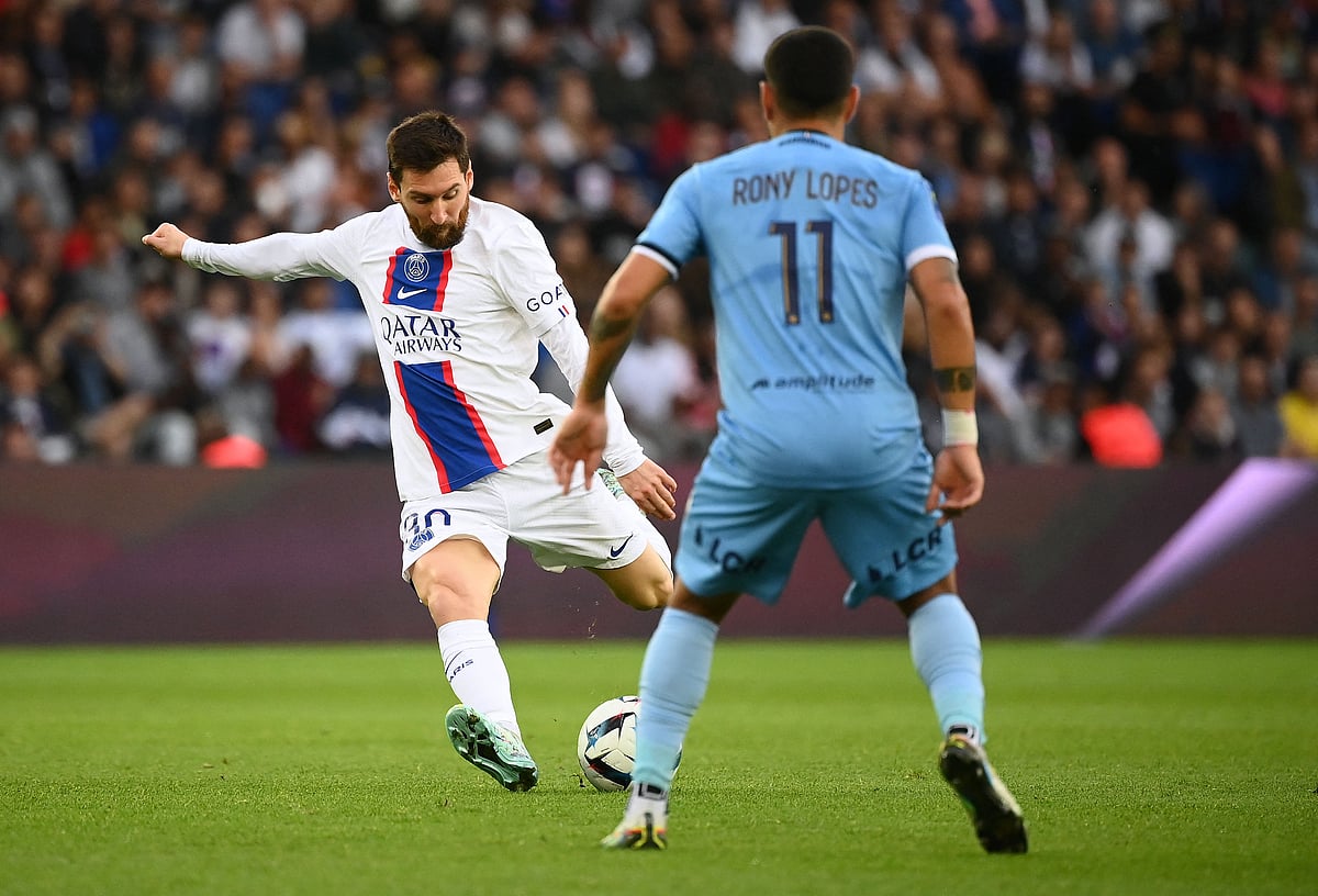 Paris Saint-Germain's Argentine forward Lionel Messi (L) kicks the ball in front of Troyes' Portuguese midfielder Rony Lopes during the French L1 football match between Paris Saint-Germain (PSG) and ES Troyes AC at The Parc des Princes Stadium in Paris on 29 October, 2022