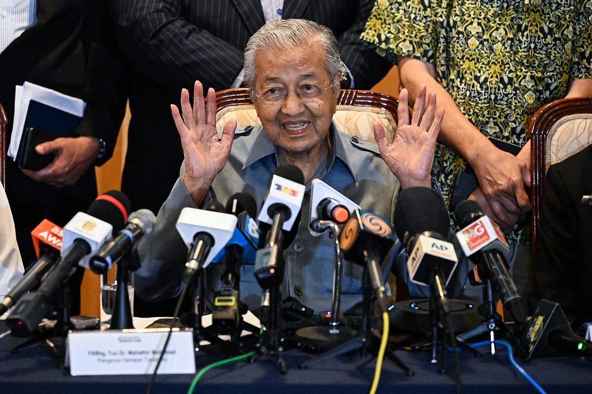 Malaysia former prime minister Mahathir Mohamad gestures as he speaks during a press conference in Putrajaya on 11 October 2022.