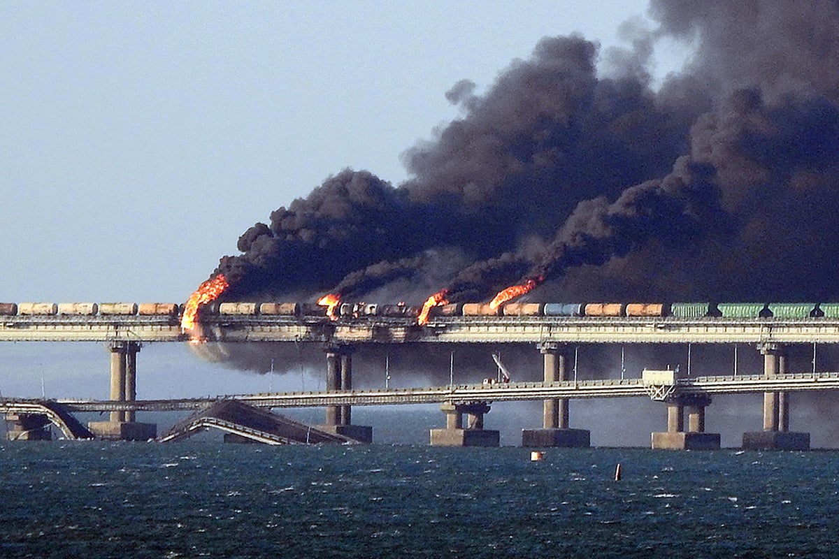 Black smoke billows from a fire on the Kerch bridge that links Crimea to Russia, after a truck exploded, near Kerch, on 8 October, 2022