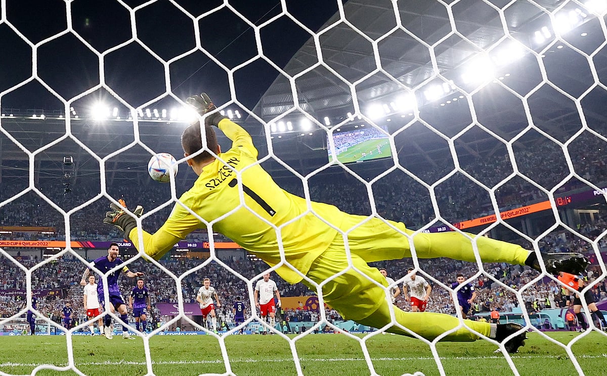 Poland's Wojciech Szczesny saves a penalty from Argentina's Lionel Messi in the FIFA World Cup Qatar 2022 Group C match of Poland v Argentina at the Stadium 974 in Doha, Qatar on 30 November, 2022