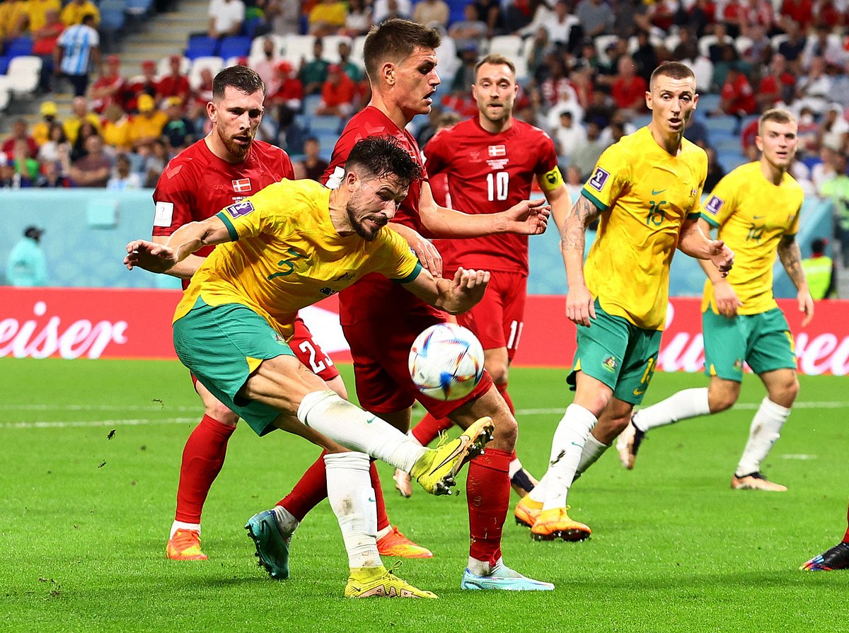 Australia's Mathew Leckie in action with Denmark's Joakim Maehle in the FIFA World Cup 2022 Group D match of Australia v Denmark at the Al Janoub Stadium in Al Wakrah, Qatar on 30 November, 2022