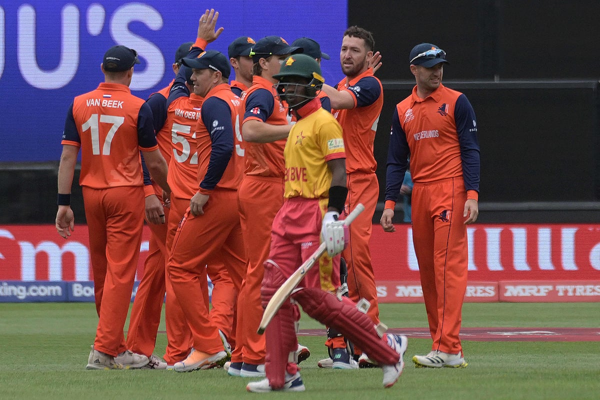 Zimbabwe's Wessly Madhevere (C) walks off the field as Netherlands' players celebrate his wicket during the ICC men's Twenty20 World Cup 2022 match between Netherlands and Zimbabwe at the Adelaide Oval on 2 November, 2022 in Adelaide