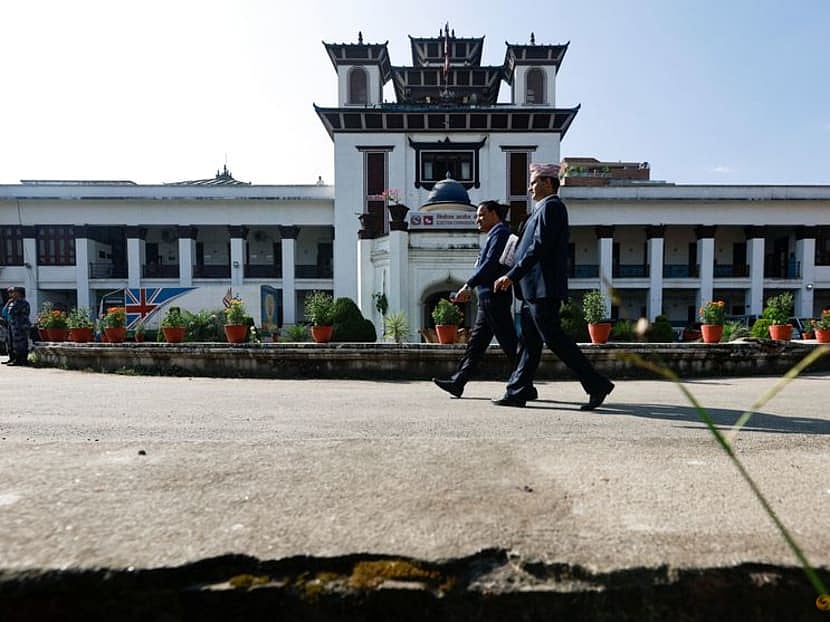 Officials walk at the premises of the Election Commission ahead of the general election scheduled for November, in Kathmandu, Nepal on 31 October, 2022.
